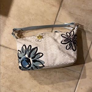 Decorated coach purse